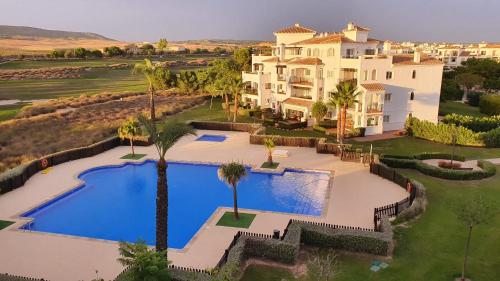 2 bedr apt with pool and lovely terrace overlooking the golf resort!