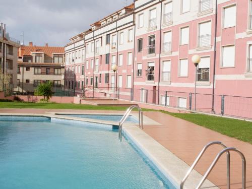 Apartamentos La Perla con piscina