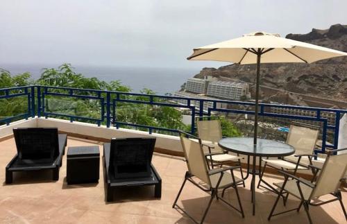 Apartment in Taurito with dream landscape and 30m2 terrace.