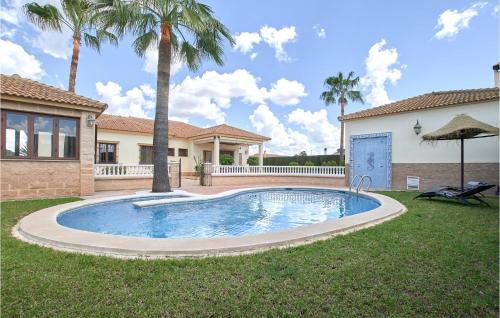 Awesome home in La Carlota with Outdoor swimming pool, WiFi and 4 Bedrooms
