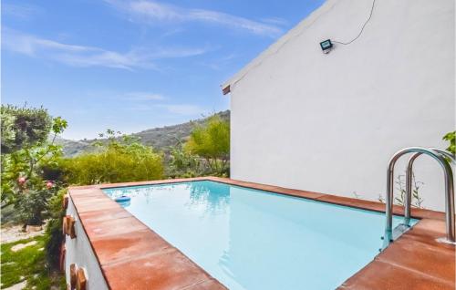 Awesome home in Málaga with Outdoor swimming pool, WiFi and 2 Bedrooms