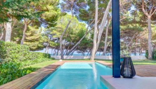 Holidays2Mallorca Front beach apartment with private, heated pool
